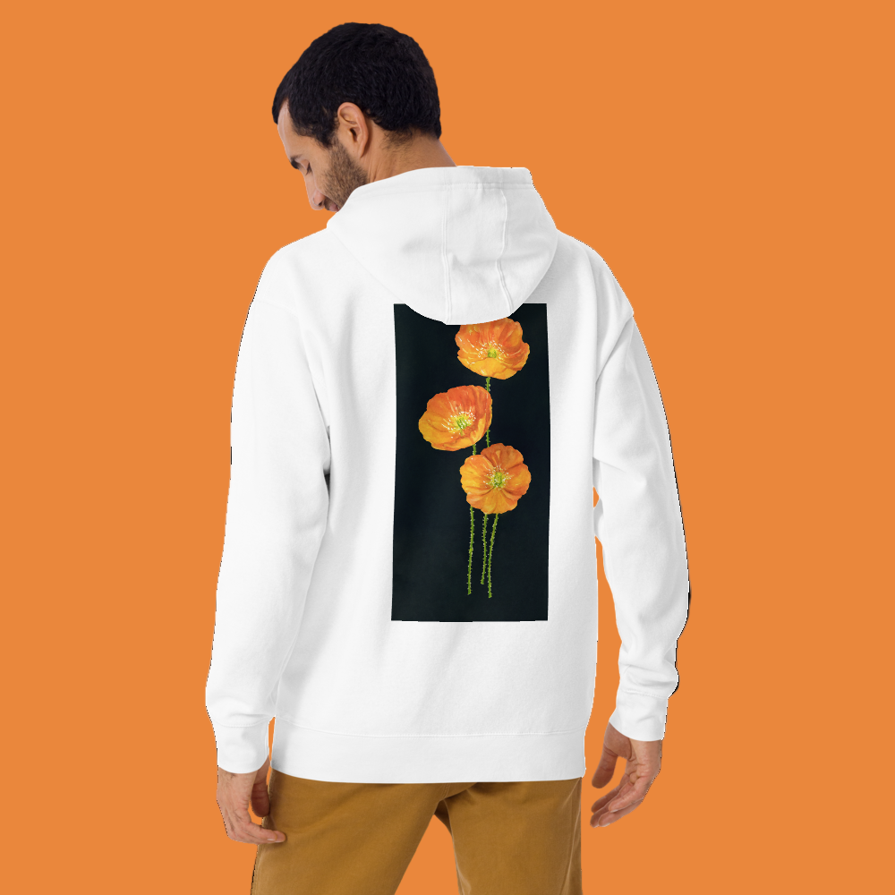 Person wearing a white hoodie with floral design on the back, standing against a orange background